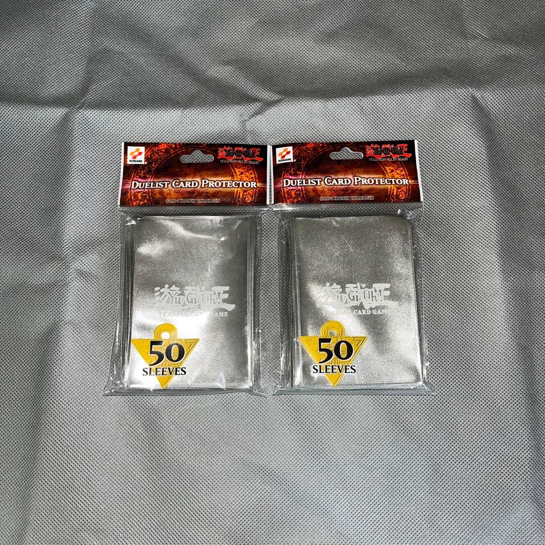 公式】 遊戯王 スリーブ 海外 初期ロゴ 50枚×2 銀 メタリック - メルカリ