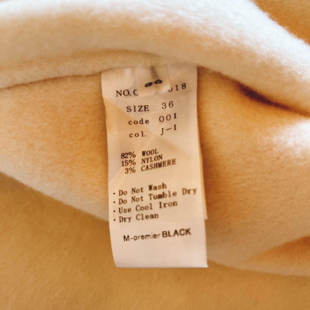 mid. エムプルミエ ブラック ノーカラーフレアケープコート アイボリー