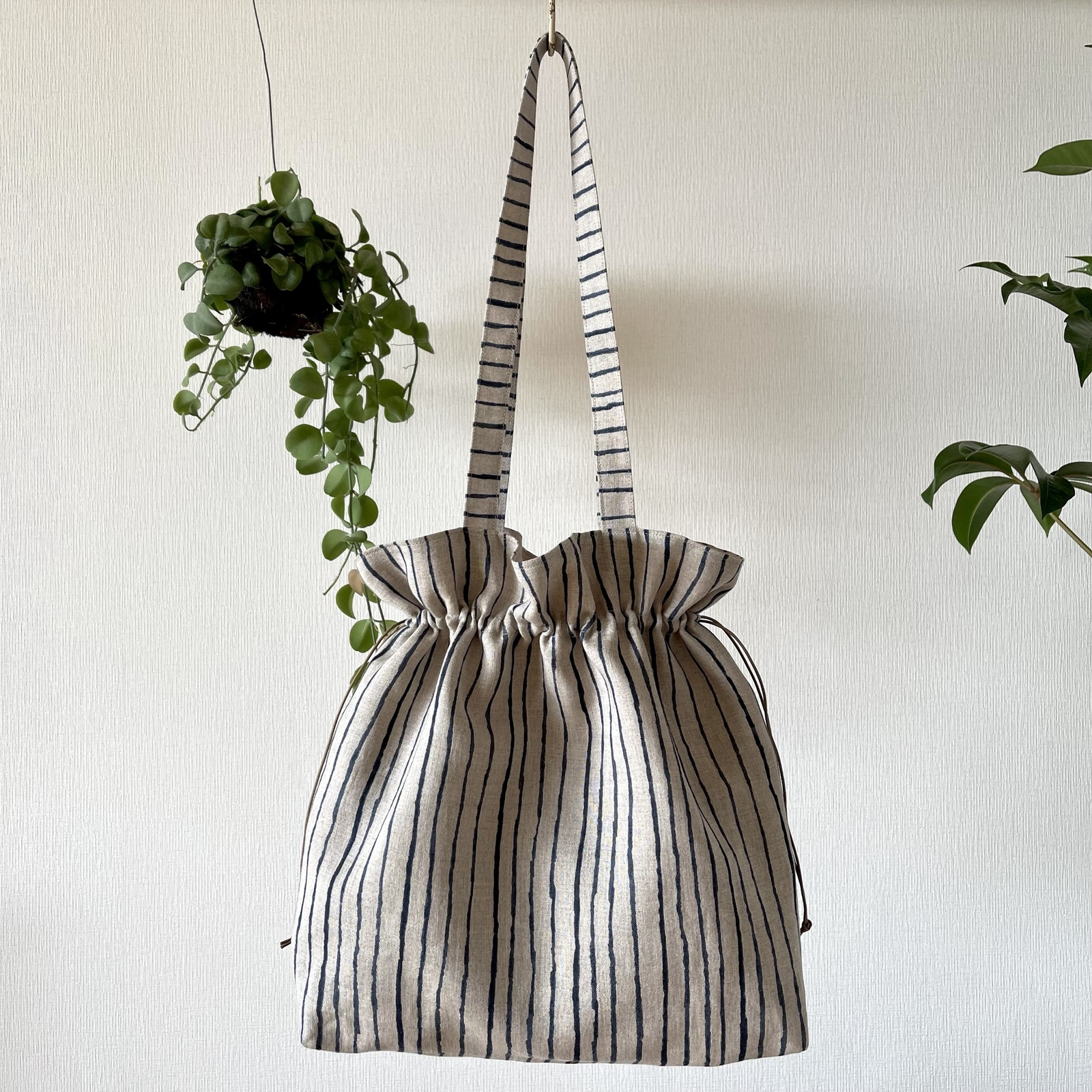 ミナペルホネン生地使用 ✳︎ swing 巾着バッグL - haruhitowork